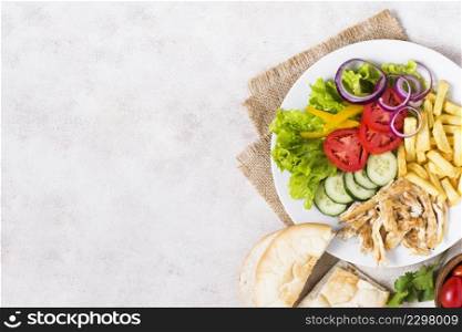 cooked meat veggies kebab white plate