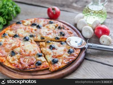 Cooked pizza on the wooden board