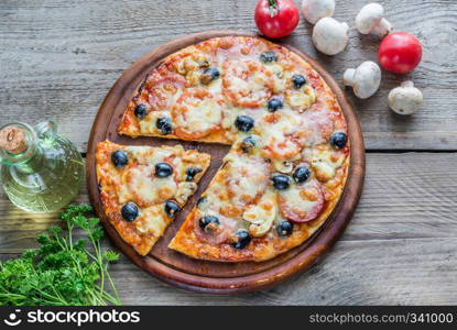 Cooked pizza on the wooden board