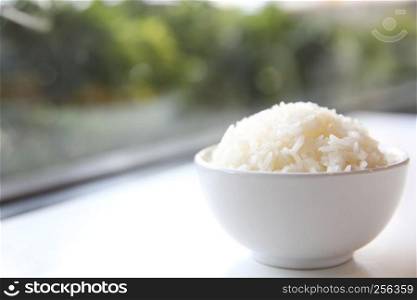 Cooked rice in bowl isolated in white background