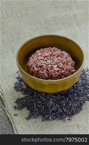 Cooked rice of Riceberry. close up of cooked rice and raw Riceberry