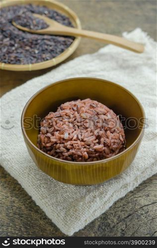 Cooked rice of Riceberry. Cooked rice of Riceberry in bowl on wooden table