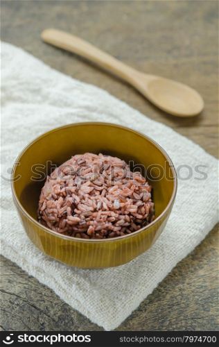 Cooked rice of Riceberry. Cooked rice of Riceberry in bowl on wooden table