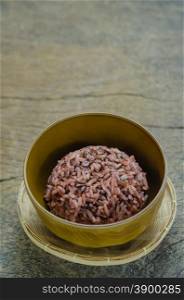 Cooked rice of Riceberry. Cooked rice of Riceberry in brown bowl on wooden table