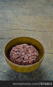 Cooked rice of Riceberry. Cooked rice of Riceberry in brown bowl on wooden table