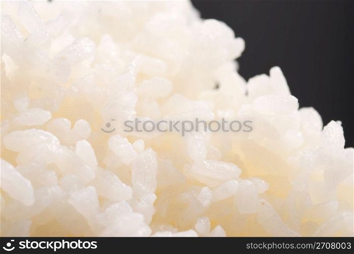 Cooked rice on black background, general Chinese food.