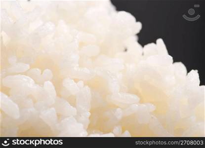 Cooked rice on black background, general Chinese food.