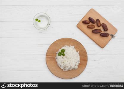 cooked rice with dates fruit wooden table. Resolution and high quality beautiful photo. cooked rice with dates fruit wooden table. High quality beautiful photo concept