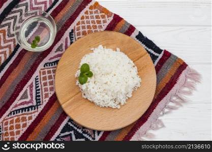 cooked rice wooden board with water