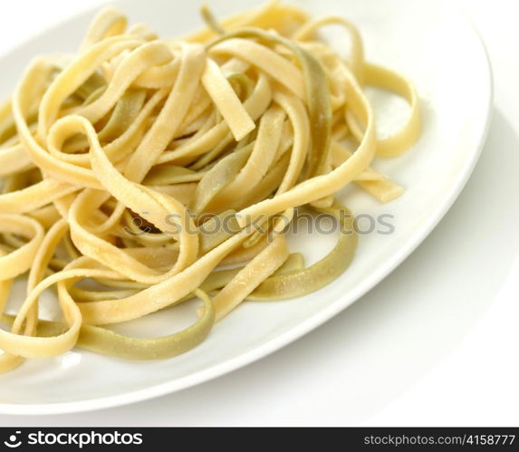 Cooked spinach pasta , close up