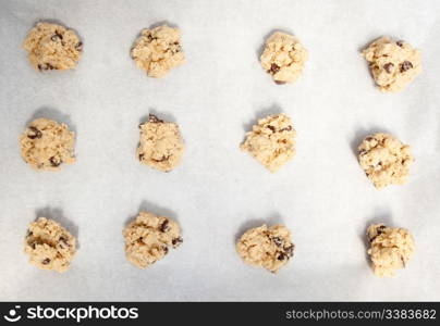 Cookie dough on a cookie sheet with baking paper