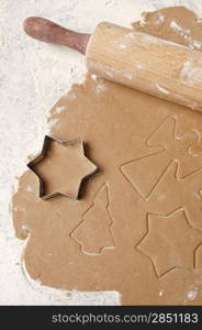 Cookie dough with christmas angles, trees and stars