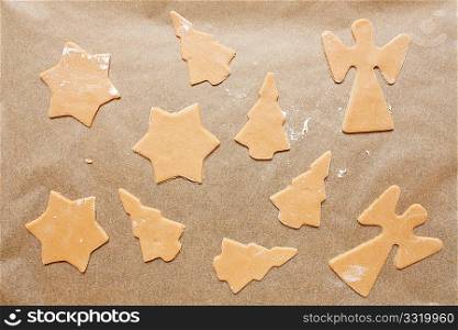 Cookie dough with christmas angles, trees and stars