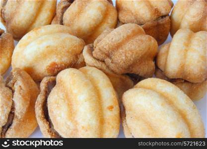 Cookies in the form of walnuts not a white background with a stuffing inside