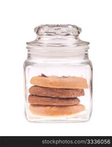 Cookies in transparent glass jar, isolated on white background.
