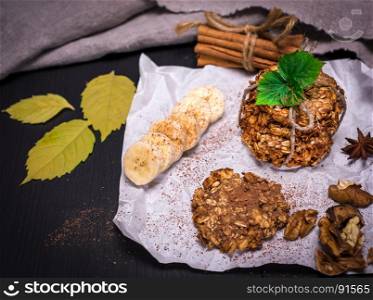 cookies made from oat flakes, nuts and seeds on white paper