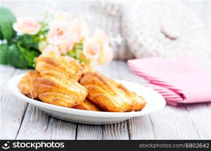 cookies on white plate and on a table