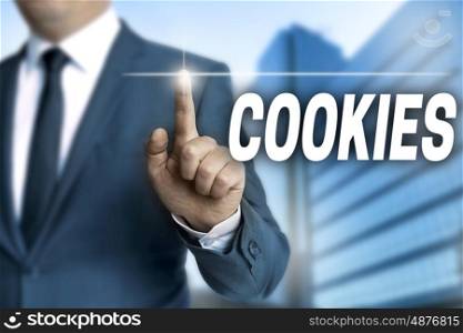cookies touchscreen is operated by businessman. cookies touchscreen is operated by businessman.
