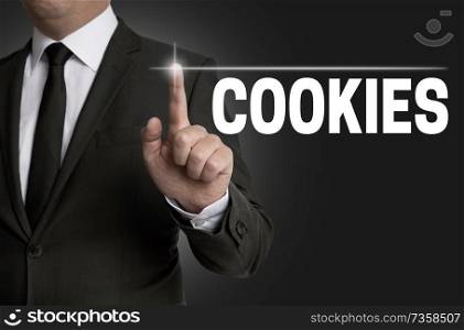 cookies touchscreen is operated by businessman.. cookies touchscreen is operated by businessman