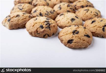 cookies with chips and pieces of chocolate on white background