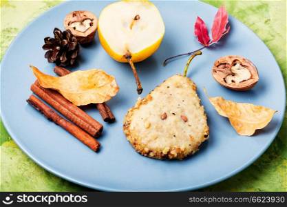 Cookies with nuts and cinnamon, in the form of a pear. Autumn baking. Autumn pear cookies
