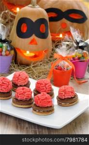 Cookies with the brains of marzipan on a table in Halloween