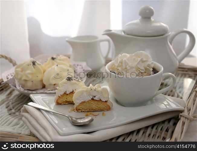 Cookies with zefirnoy filling in milk glaze with a cup of coffee and whipped cream