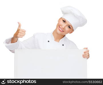 cooking, advertisement and food concept - smiling female chef, cook or baker with white blank board showing thumbs up