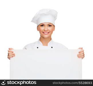 cooking, advertisement and food concept - smiling female chef, cook or baker with white blank board