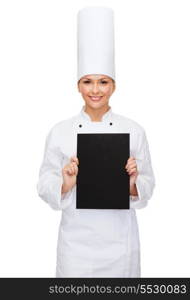 cooking, advertisement and food concept - smiling female chef with blank black paper