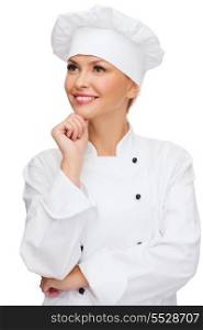 cooking and food concept - smiling female chef, cook or baker dreaming