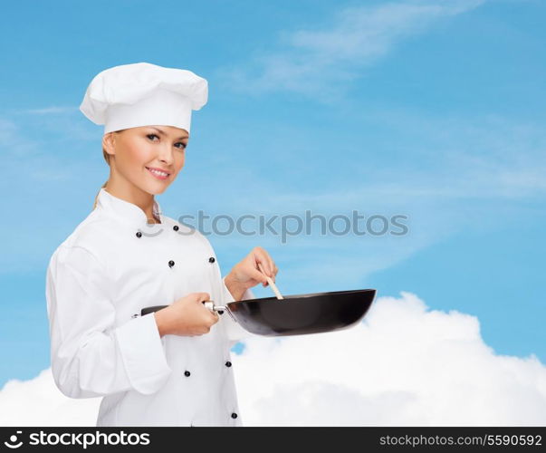 cooking and food concept - smiling female chef, cook or baker with pan and spoon