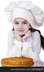 Cooking and people concept - smiling little girl in cook hat, isolated on white background