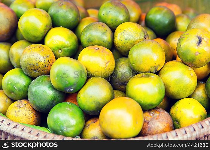 cooking, asian kitchen, sale and food concept - mandarins at street market