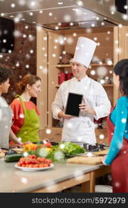 cooking class, culinary, food, technology and people concept - happy women with chef cook showing blank tablet pc screen in kitchen over snow effect