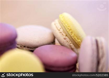cooking, confectionery and baking concept - close up of macarons. close up of macarons