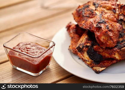 cooking, culinary and food concept - close up of grilled barbecue meat stack on plate. grilled barbecue meat stack on plate