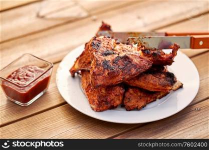 cooking, culinary and food concept - close up of grilled barbecue meat stack on plate. grilled barbecue meat stack on plate