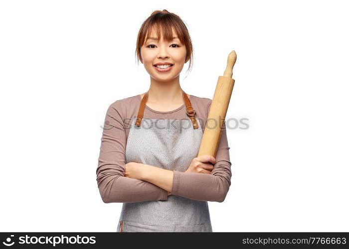 cooking, culinary and people concept - happy smiling female chef in apron with wooden rolling pin over white background. happy woman in apron with wooden rolling pin