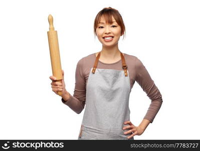 cooking, culinary and people concept - happy smiling female chef in apron with wooden rolling pin over white background. happy woman in apron with wooden rolling pin