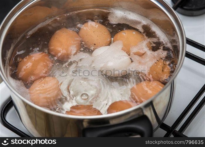 cooking Eggs in boiling water in pan Top view, healthy food. cooking Eggs in boiling water in pan Top view