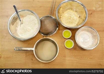 cooking food and baking concept - bowls with flour and egg whites at bakery kitchen. bowls with flour and egg whites at bakery kitchen