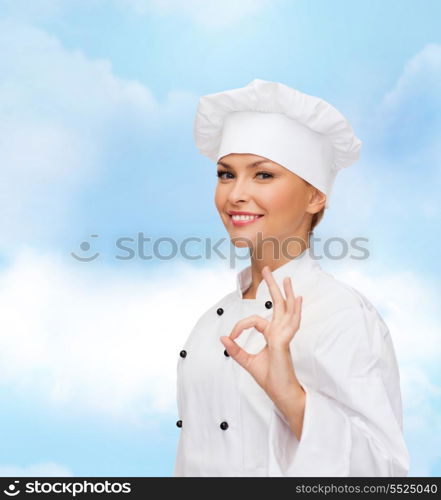 cooking, gesture and food concept - smiling female chef showing ok hand sign