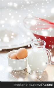 cooking, home and food concept - close up of milk jug, eggs in a bowl, whisk and flour