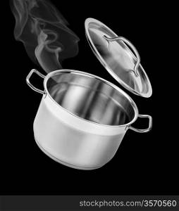 Cooking in the pot with lid isolated on black