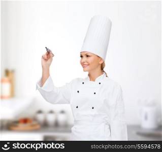 cooking, new technology , advertisement and food concept - smiling female chef with marker writing something on virtual screen