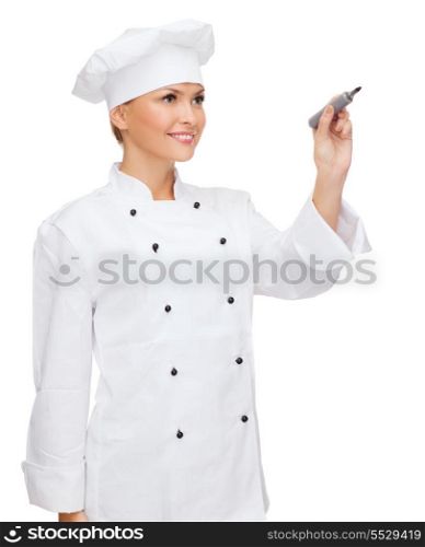 cooking, new techology , advertisement and food concept - smiling female chef, cook or baker with marker writing something on virtual screen