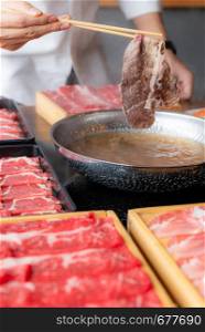 Cooking of japanese wagyu beef Shabu Shabu set hot pot