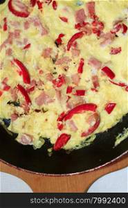 cooking of omelet with red paprika . cooking of omelet with red paprika and sausage