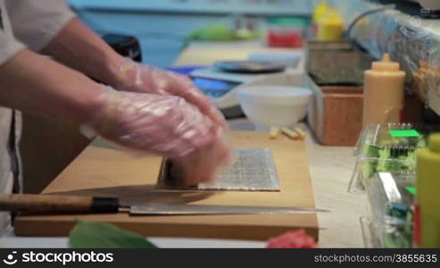 Cooking Of Salmon Sushi Roll In Catering.